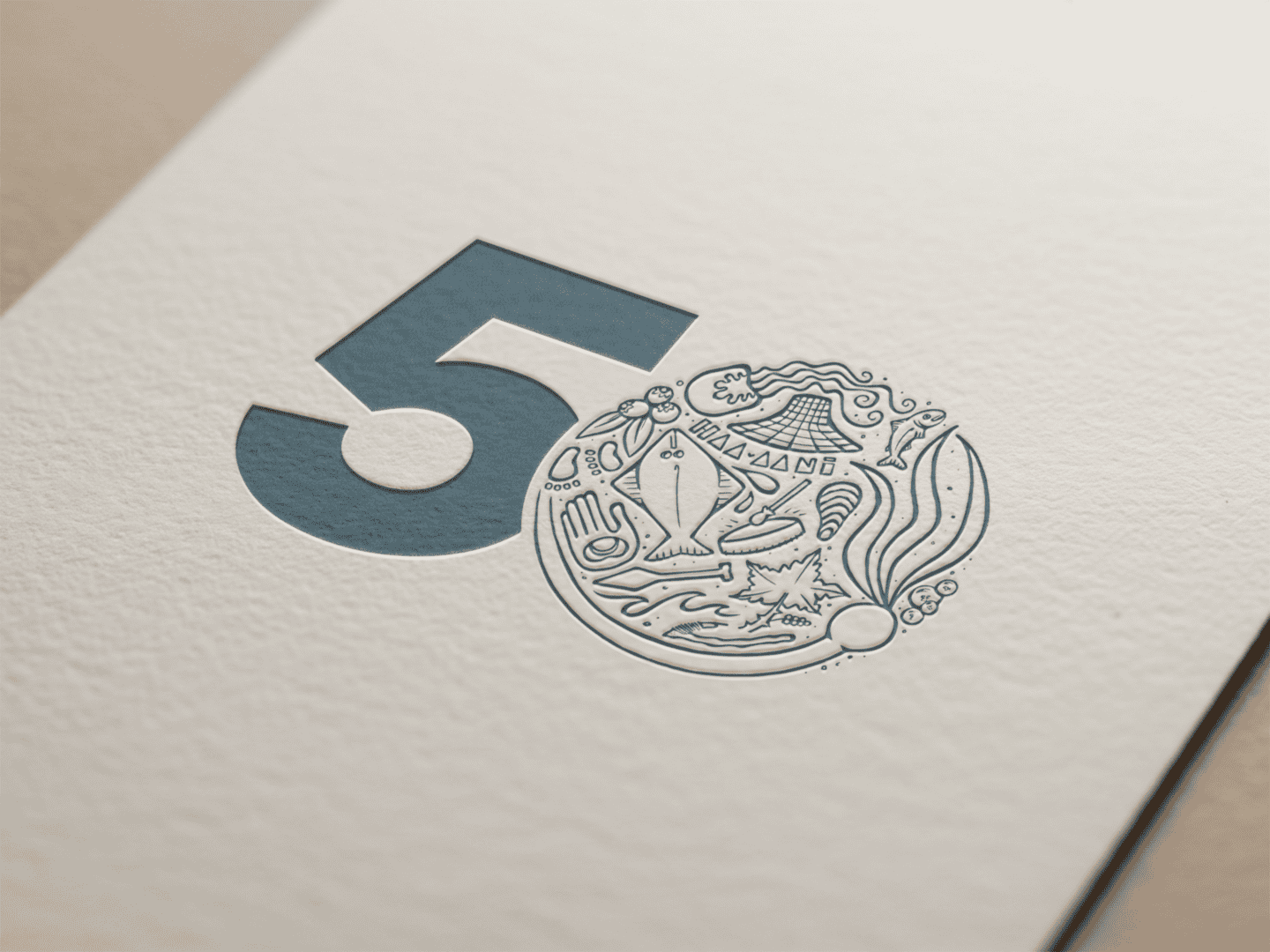 Sealaska's 50th anniversary logo on a piece of paper